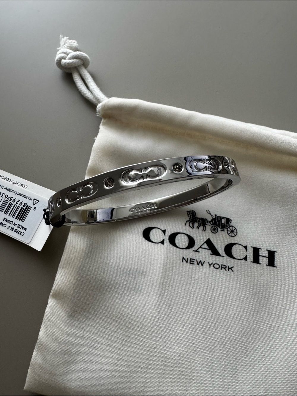 Coach Silver-Tone Signature Bangle Bracelet